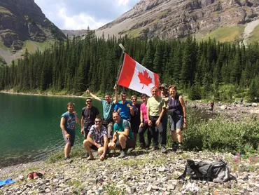 Group at alpine lake hiking tour in canadian rockies