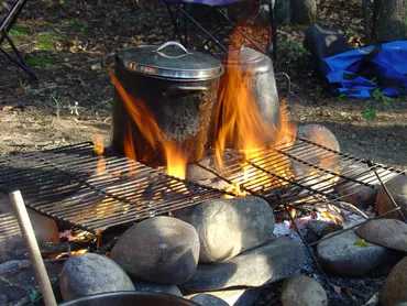 Cooking on the open fire camping tour in british columbia