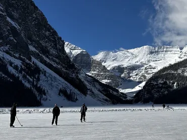 Skating on frozen Lake Louise winter tour, Lake Louise, Canada